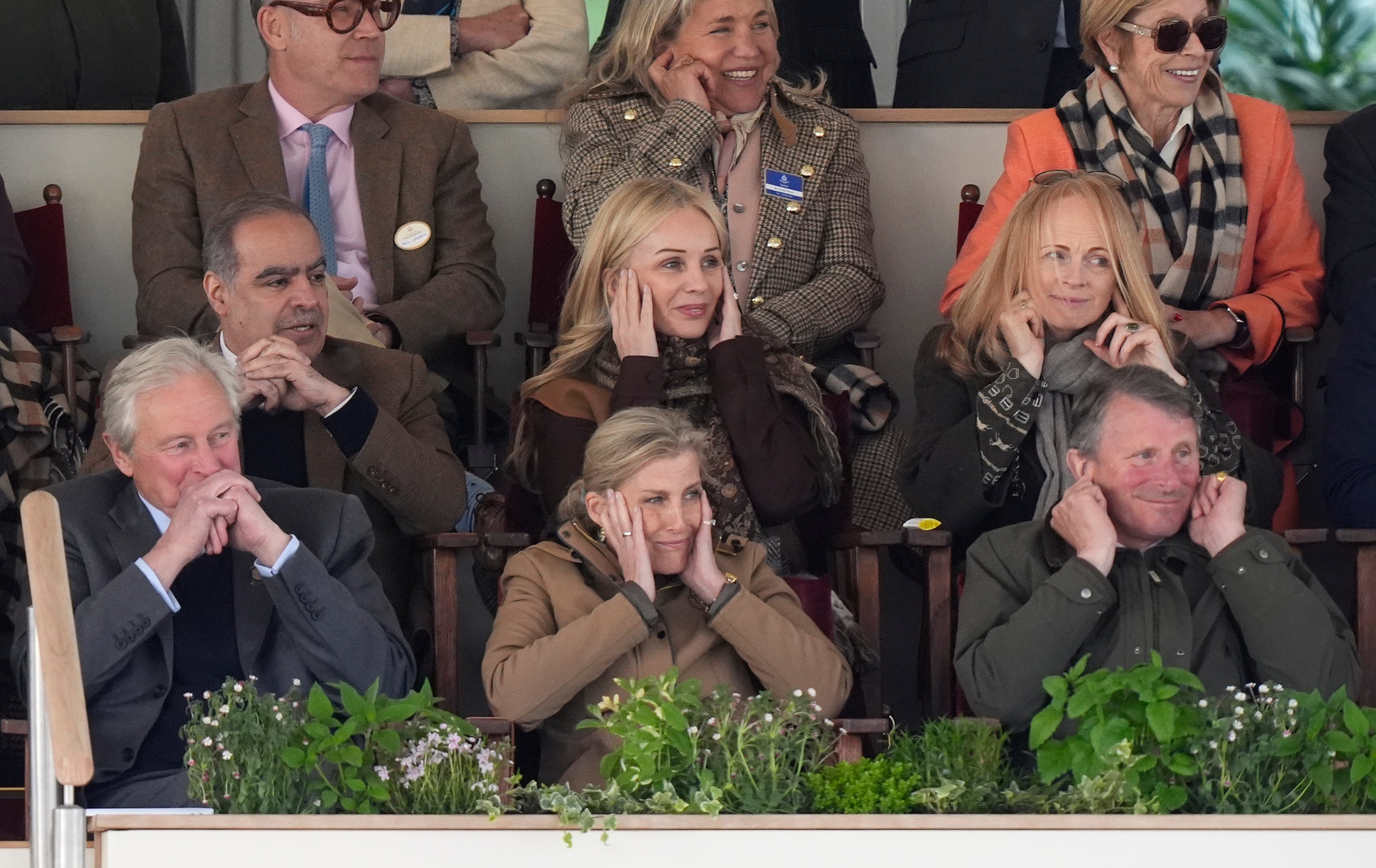 The Duchess of Edinburgh (centre) reacts as members of the King's Troop, Royal Horse Artillery fire their guns during the Royal Windsor Horse Show