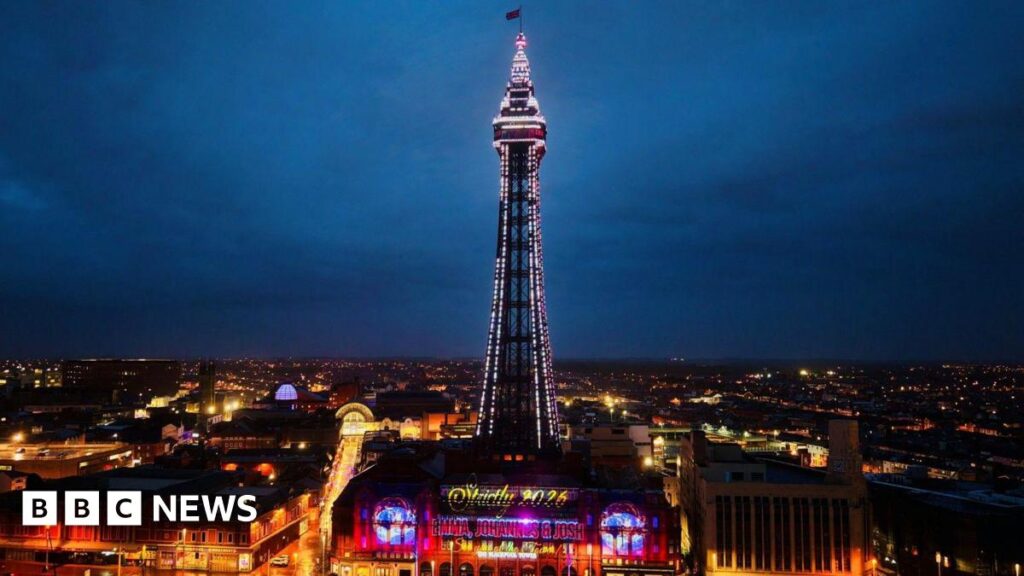 An illuminated Blackpool Tower with a sign highlighting Strictly 2026