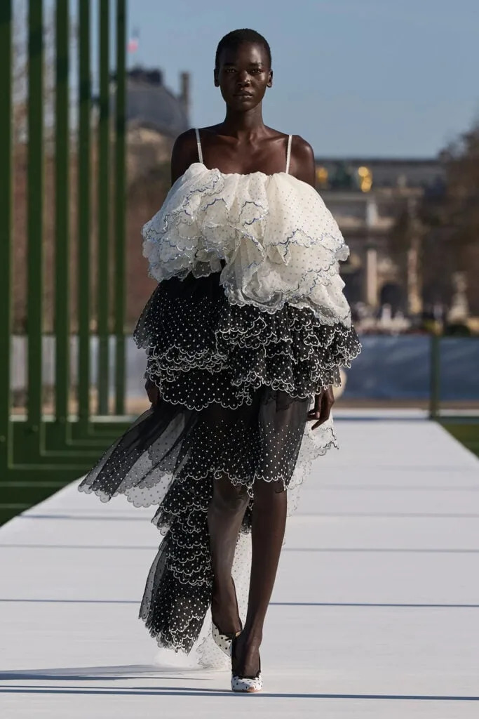 Dior Fall 2026 runway look featuring a layered black-and-white tulle skirt and ruffled bodice