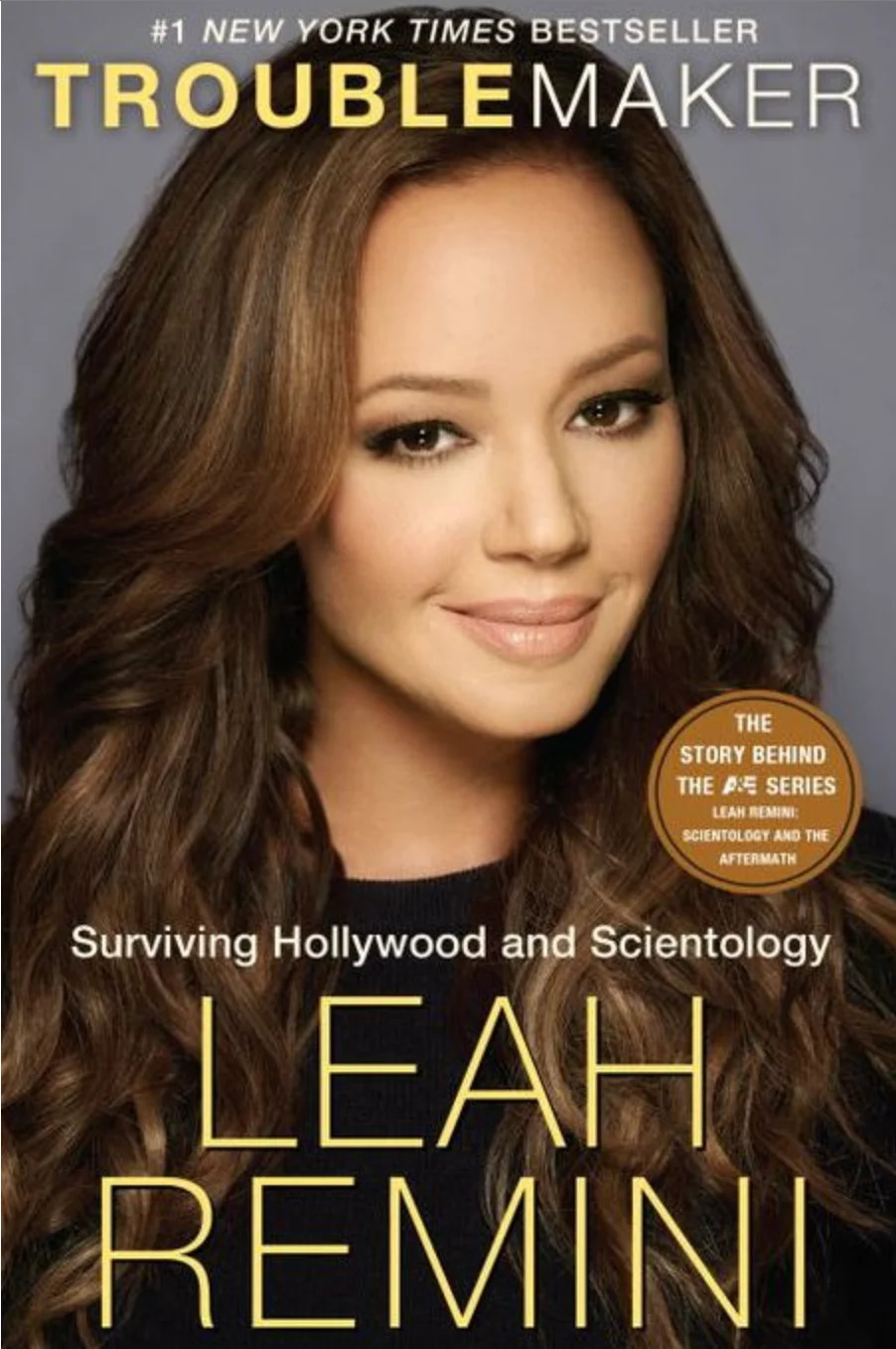 Cover of "Troublemaker" by Leah Remini, featuring the author with long hair. Text highlights surviving Hollywood and Scientology
