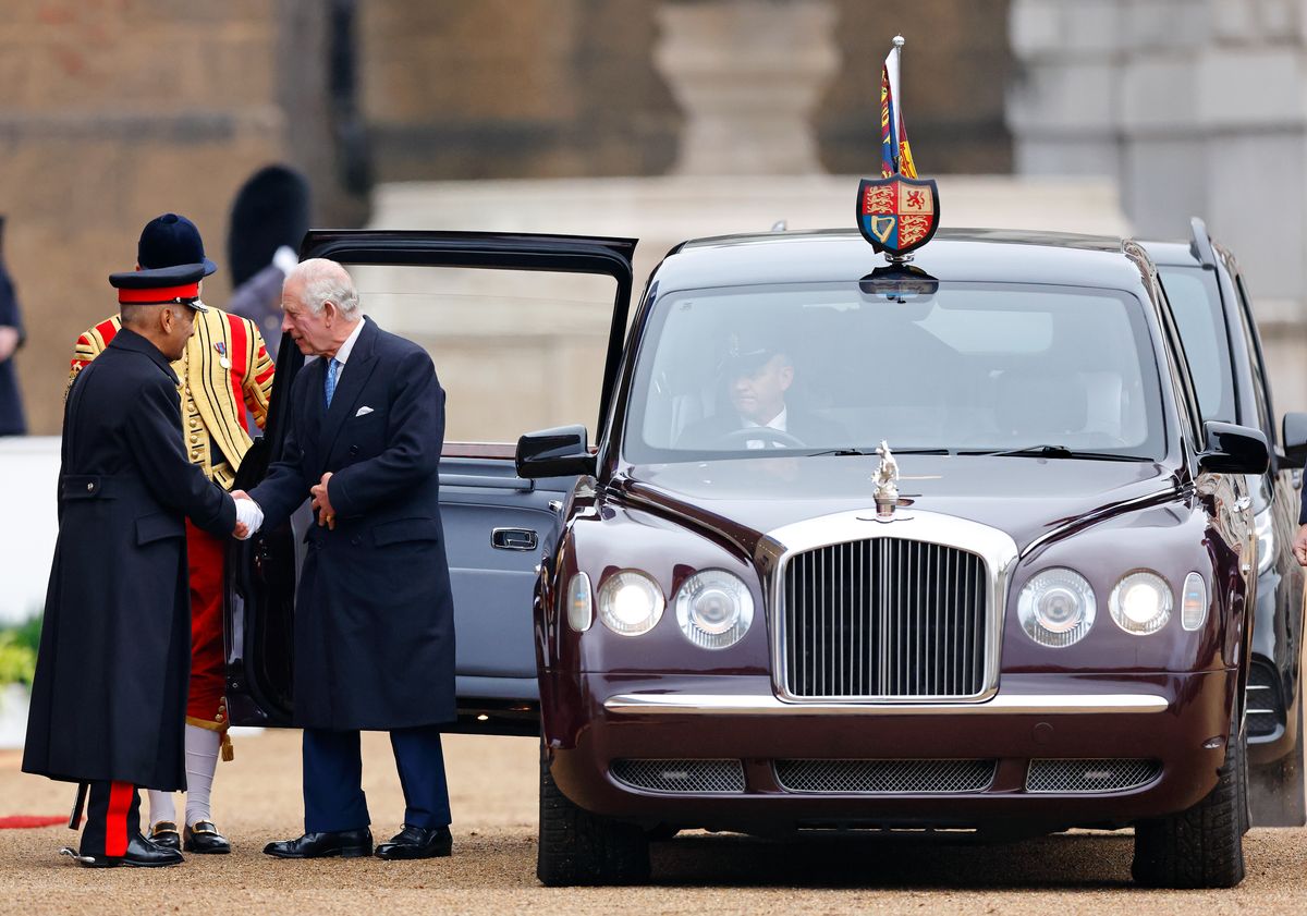 King Charles getting out of a Bentley