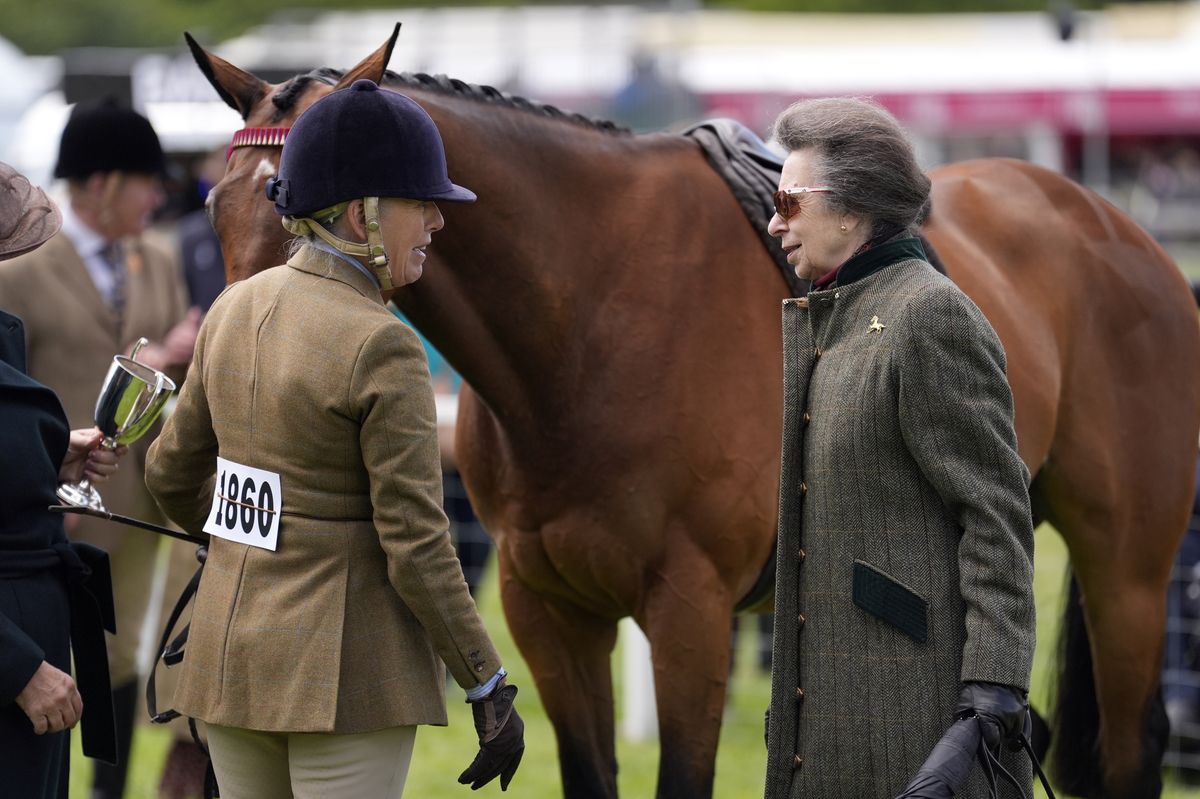 The Princess Royal with rider Katie Jerram Hunnable after she won the series qualifier on First Receiver, owned by His Majesty The King, during the Royal Windsor Horse Show