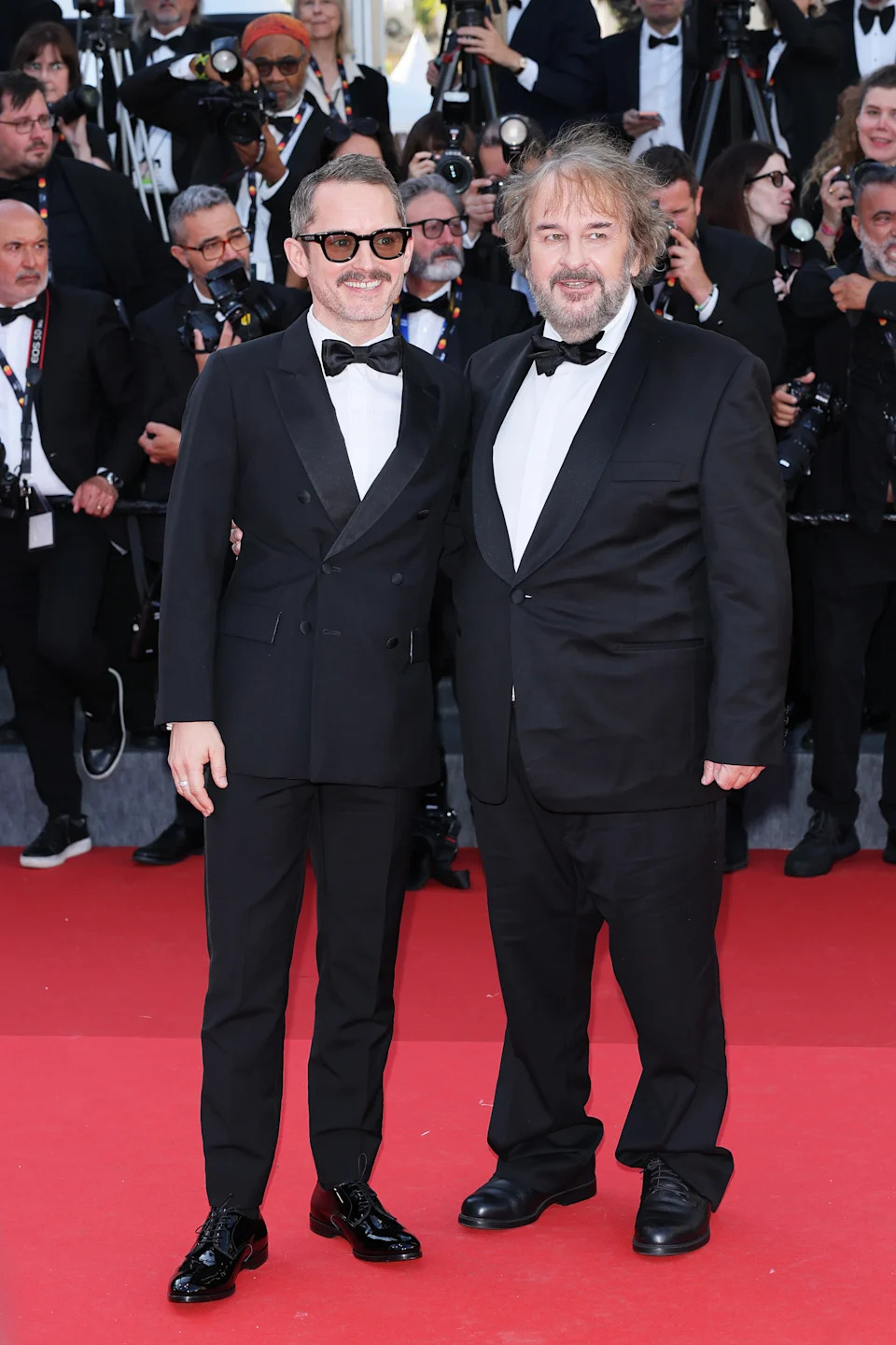 CANNES, FRANCE - MAY 12: Elijah Wood  and Peter Jackson attend the opening ceremony and "La Vénus Electrique" (The Electric Venus) screening during the 79th annual Cannes Film Festival at Palais des Festivals on May 12, 2026 in Cannes, France. (Photo by Ernesto Ruscio/Getty Images)