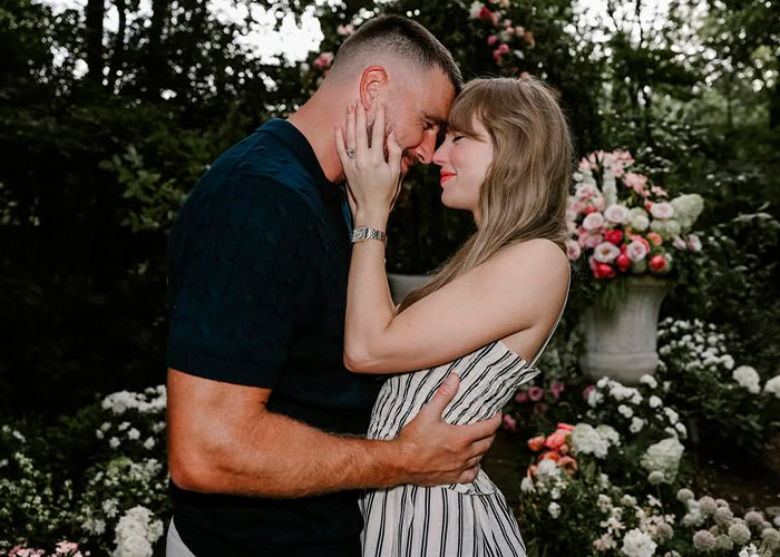 Couple embracing in garden with flowers related to Taylor Swift wedding plans