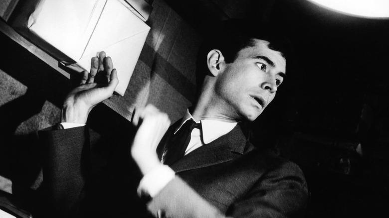 Josef K. looking over his shoulder in The Trial (1962)