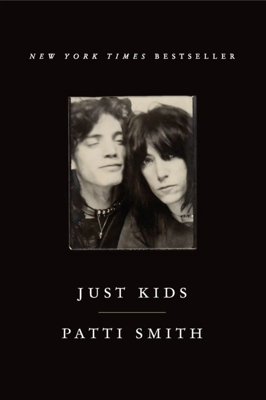 Cover of "Just Kids" by Patti Smith, featuring a black-and-white photo of two people. Book is a New York Times bestseller