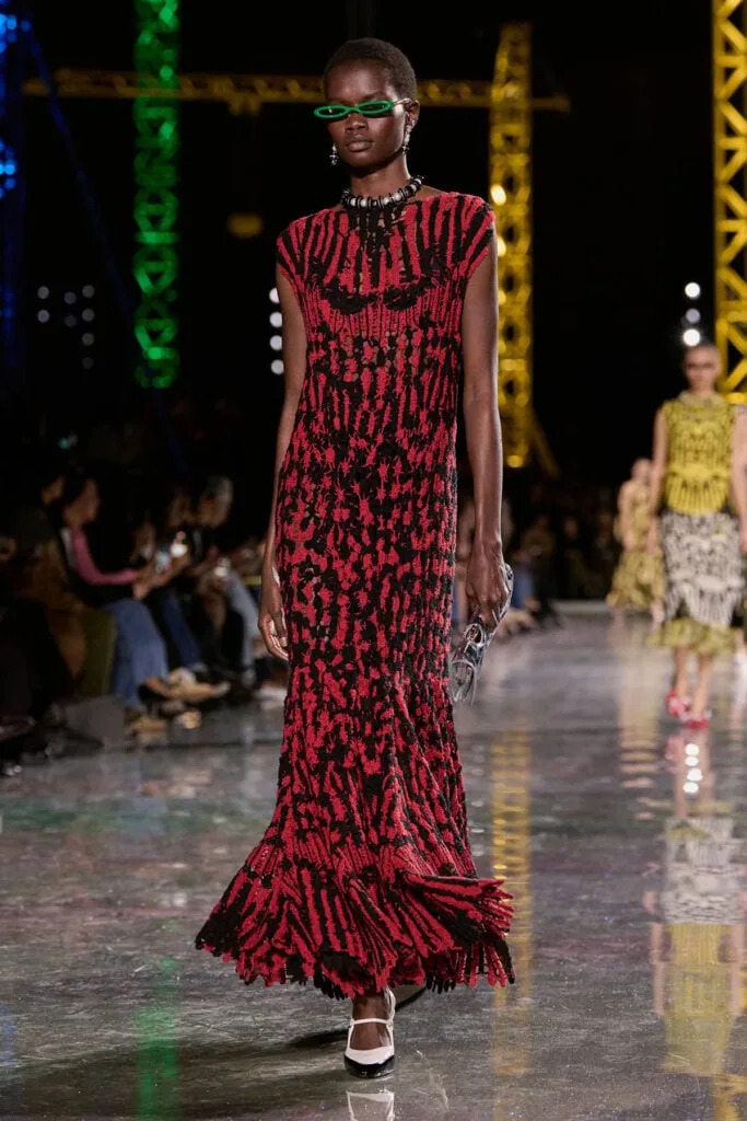 Chanel Fall 2026 black-and-red textured gown on the runway during Paris Fashion Week.