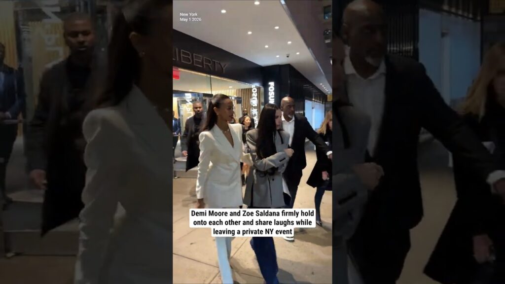 Demi Moore and Zoe Saldana hold onto each other and share laughs while leaving a private NY event