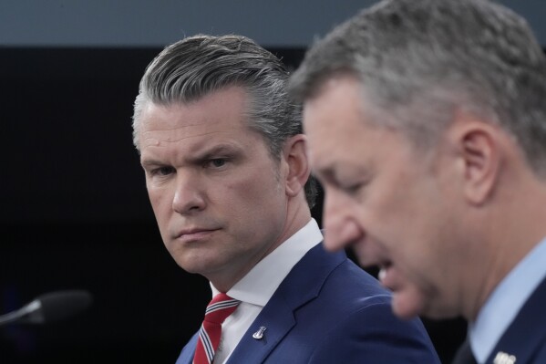 Defense Secretary Pete Hegseth and Chairman of the Joint Chiefs of Staff Gen. Dan Caine speak to members of the media during a press briefing at the Pentagon in Washington, Tuesday, May 5, 2026. (AP Photo/Manuel Balce Ceneta)