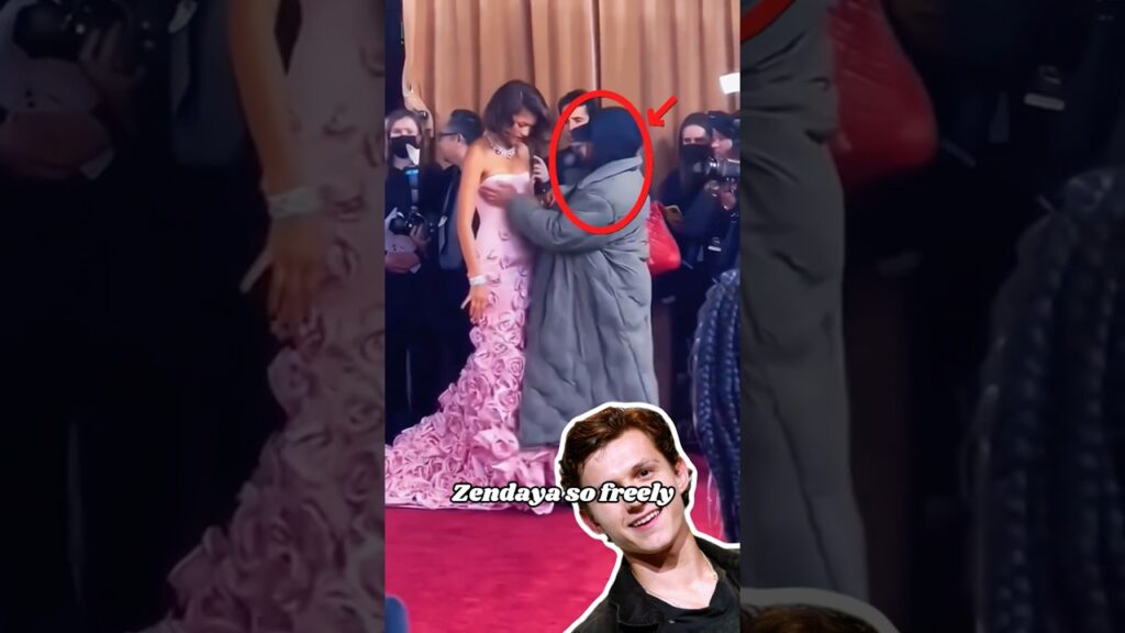 Why would Tom Holland allow this man to touch Zendaya so freely, even touching her chest and waist?