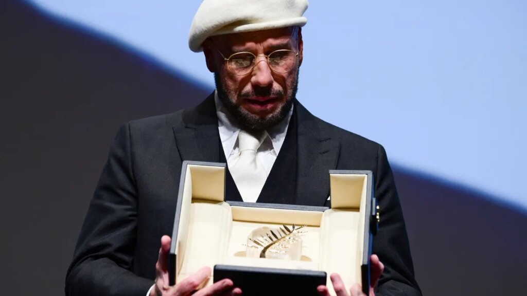 John Travolta cries after surprise award at Cannes Film Festival John Travolta cries after surprise award at Cannes Film Festival