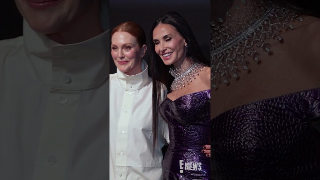 Julianne Moore and Demi Moore embrace at the Kering Women In Motion Awards in Cannes.
