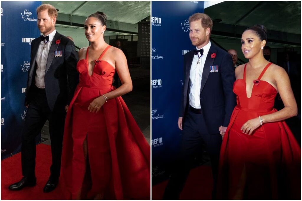 Gosh! Meghan Markle Returns to Red Carpet With Prince Harry in a Fiery Red Gown With Plunging Neckline Gosh! Meghan Markle Returns to Red Carpet With Prince Harry in a Fiery Red Gown With Plunging Neckline. Picture Credits: AP
