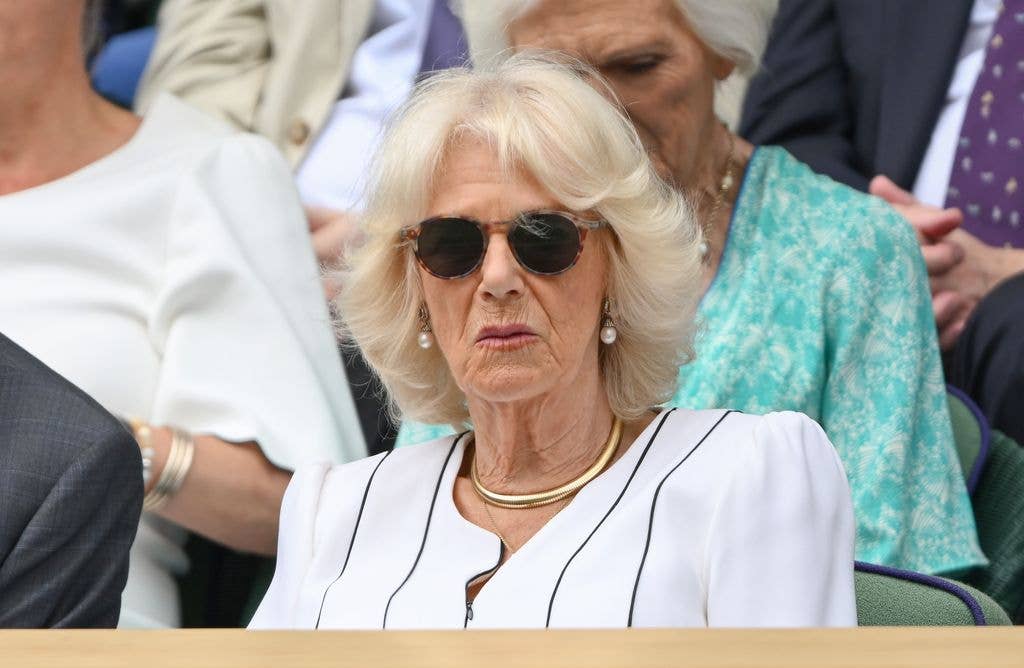 Queen Camilla in a white dress and sunglasses at Wimbledon
