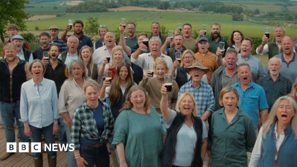 The Hawkstone Choir is a large group of farmers, all together and singing.