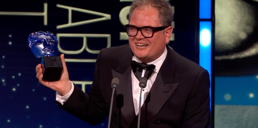 Alan Carr Shouts Out 'Thick' Celebrity Traitors Co-Stars After Winning A TV Bafta
