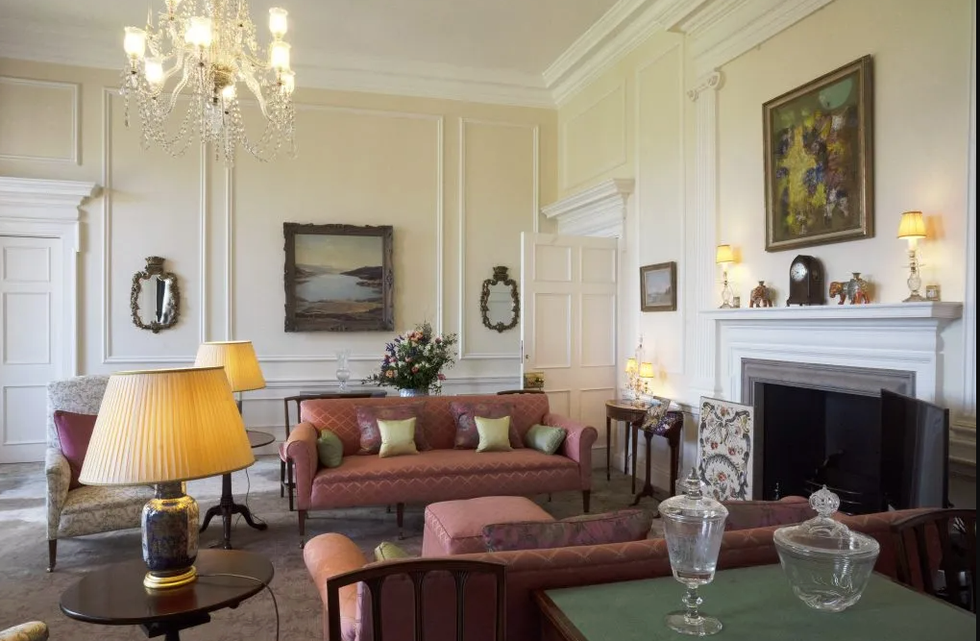 Living room with decorative furnishings and artwork.