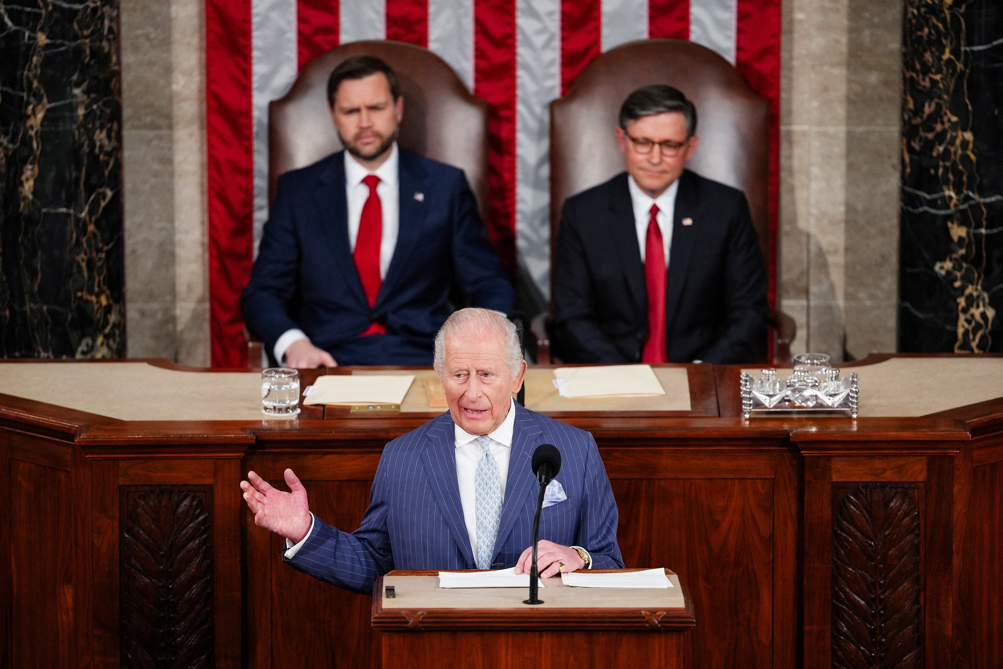 Vice President JD Vance, left, looked on as Charles gave his speech