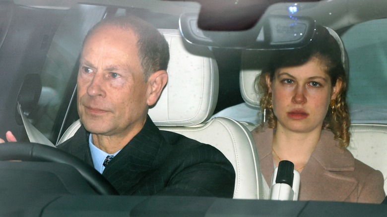 Lady Louise Windsor in the back of a car being driven by her dad in late 2025