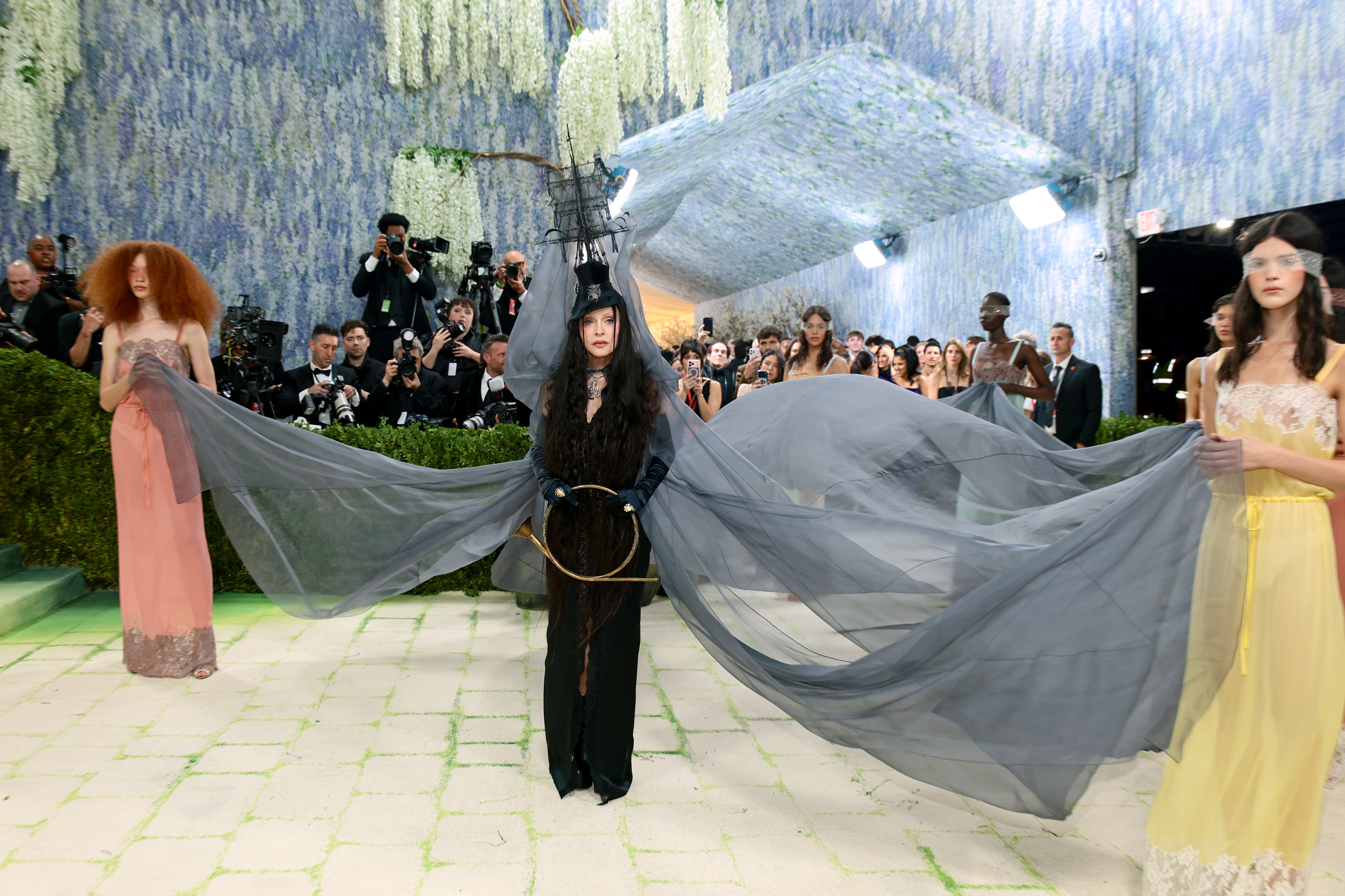 The ‘Vogue’ singer was also joined by several women with sheer blindfolds who helped display her outfit