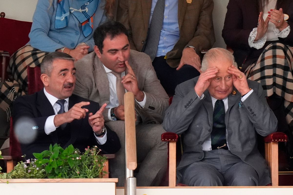King Charles III (right) watches a display in the Castle arena during the Royal Windsor Horse Show