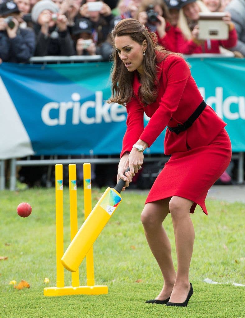 Princess Kate hits a ball bowled by Prince William as they play a game of cricket during a visit to Latimer Square in Christchurch on April 14, 2014