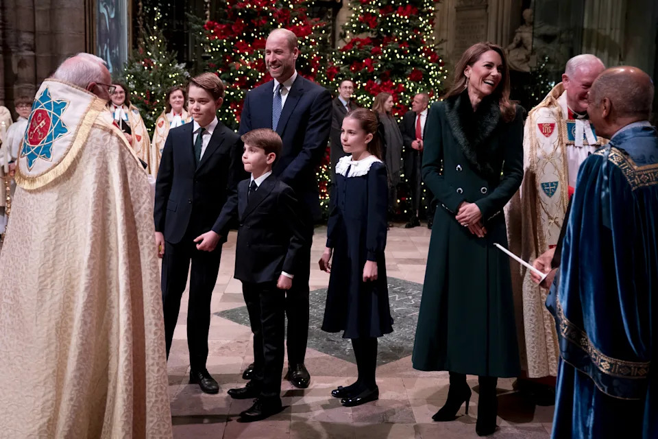 Prince George, Princess Charlotte and Prince Louis at Westminster Abbey talking to a clergyman