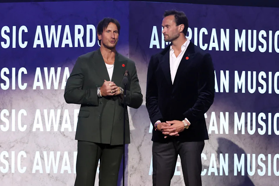 Russell Dickerson and U.S. Marine Corps veteran Jake Wood onstage.