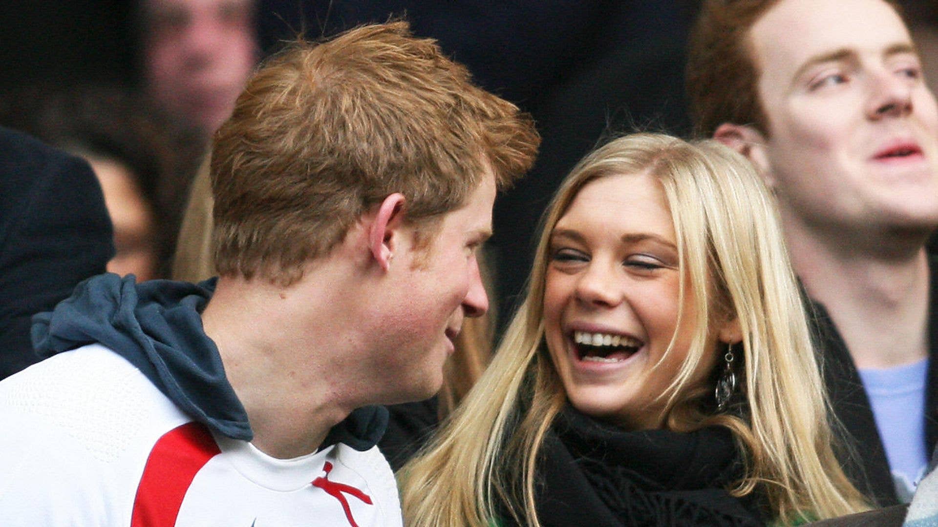 Prince Harry and Chelsy Davy laughing during a rugby match