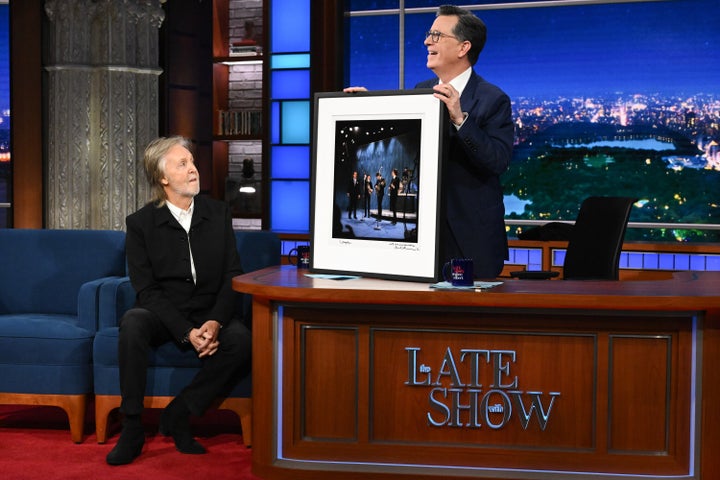 Paul McCartney gifts Stephen Colbert a framed photo of The Beatles on "The Ed Sullivan Show" in 1964, which was filmed at the same theater as "The Late Show."