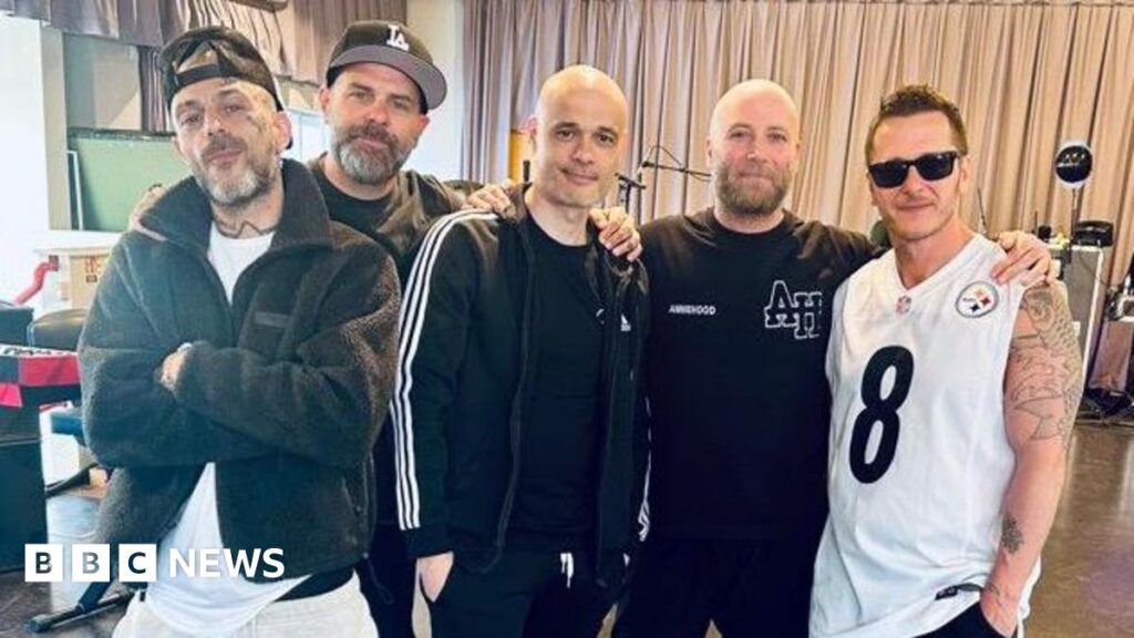 Boyband Five pose in the studio.