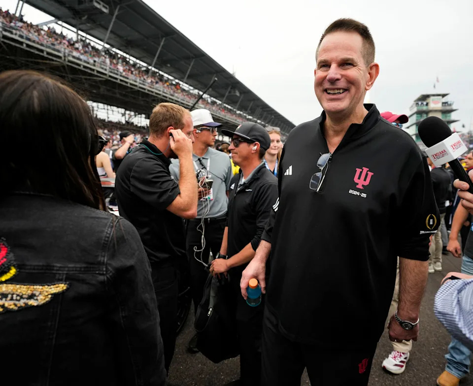Indiana University's Curt Cignetti walks through pit lane Sunday, May 24, 2026, ahead of the 110th running of the Indianapolis 500 at Indianapolis Motor Speedway.