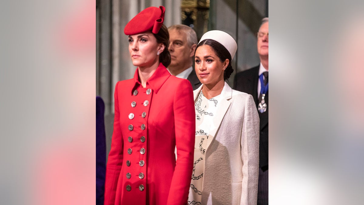 Catherine, Duchess of Cambridge, and Meghan, Duchess of Sussex, standing at Westminster Abbey