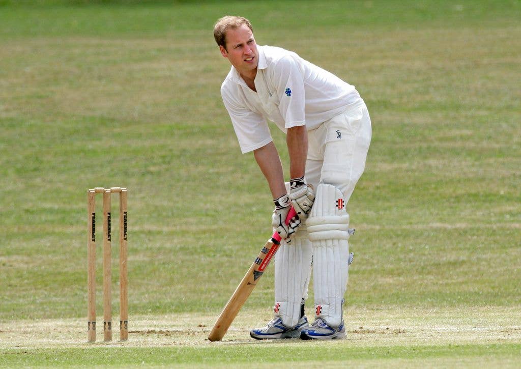 Prince William plays cricket for the Kings Head Inn pub team in a beer match on July 17, 2010