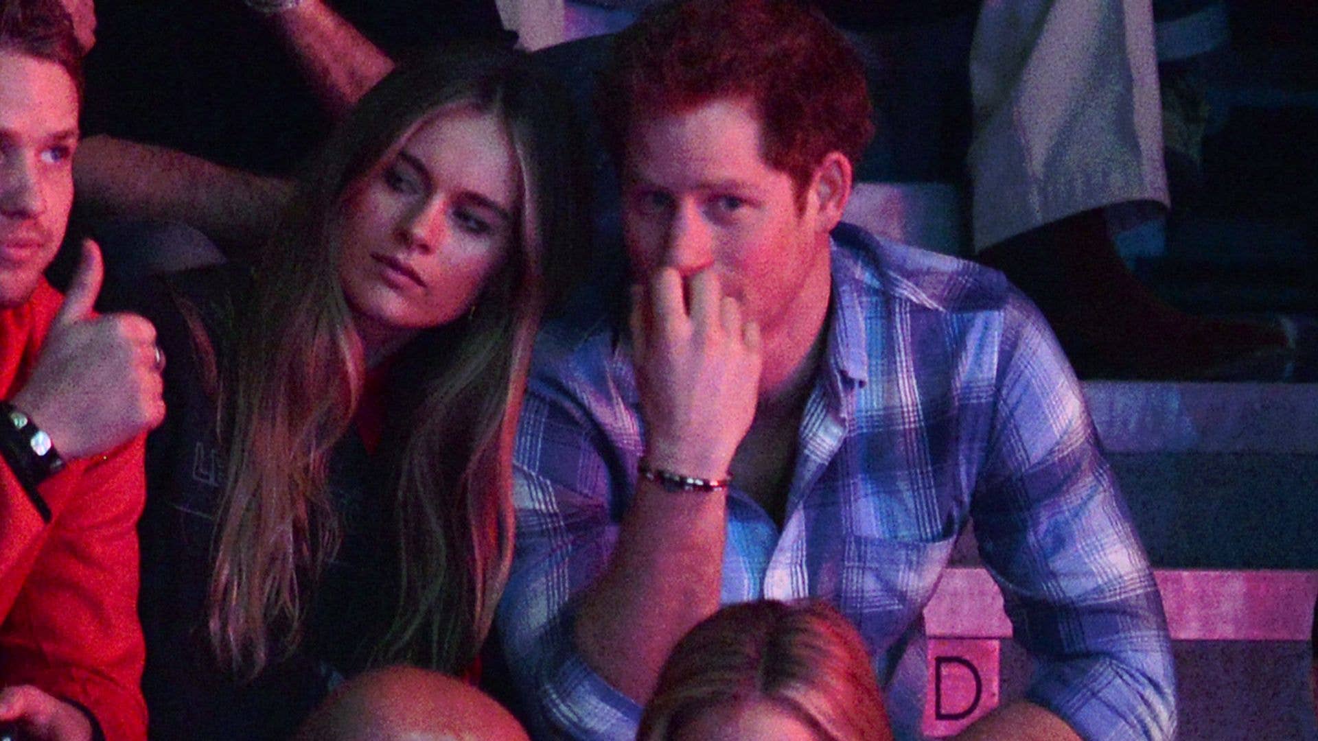 Cressida Bonas and Prince Harry sitting at an event