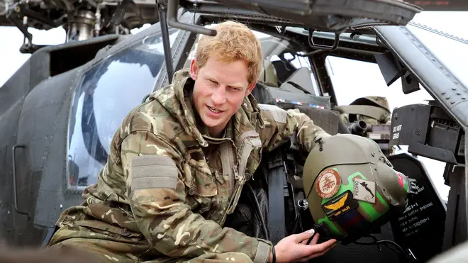 File photo dated 12/12/2012 of Prince Harry or just plain Captain Wales as he is known in the British Army, shows a TV crew his flight Helmet as he makes his early morning pre-flight checks on the flight-line, at Camp Bastion southern Afghanistan