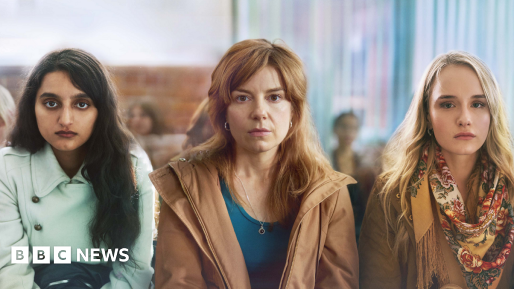 ITV crime drama about black cab rapist ‘important story to tell’ This image shows three women sat side by side, the woman on the left hand side has long brown hair, brown eyes and is wearing a light blue coat. The woman in the middle has long ginger hair, brown eyes and is wearing a dark blue top and brown jacket. The woman on the right hand side has blonde hair, brown eyes, and is wearing a yellow floral patterned scarf and a brown jacket. All the woman have blank, emotionless expressions.