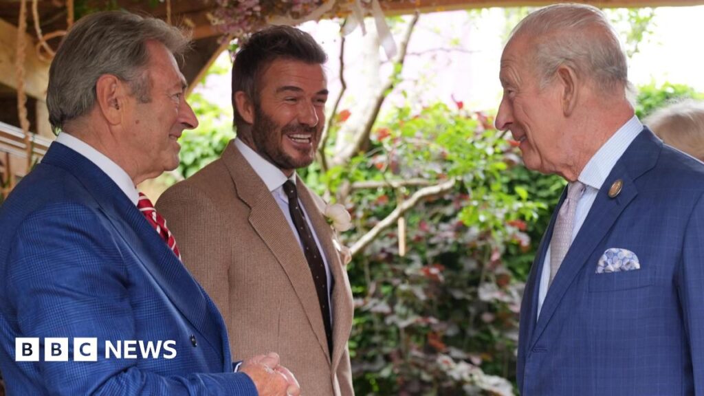 RHS Chelsea Flower Show: Charles and Camilla view gardens as gnome ban lifted King Charles III and Queen Camilla, watched by Sir David Beckham (right) view the RHS and The King's Foundation Curious Garden