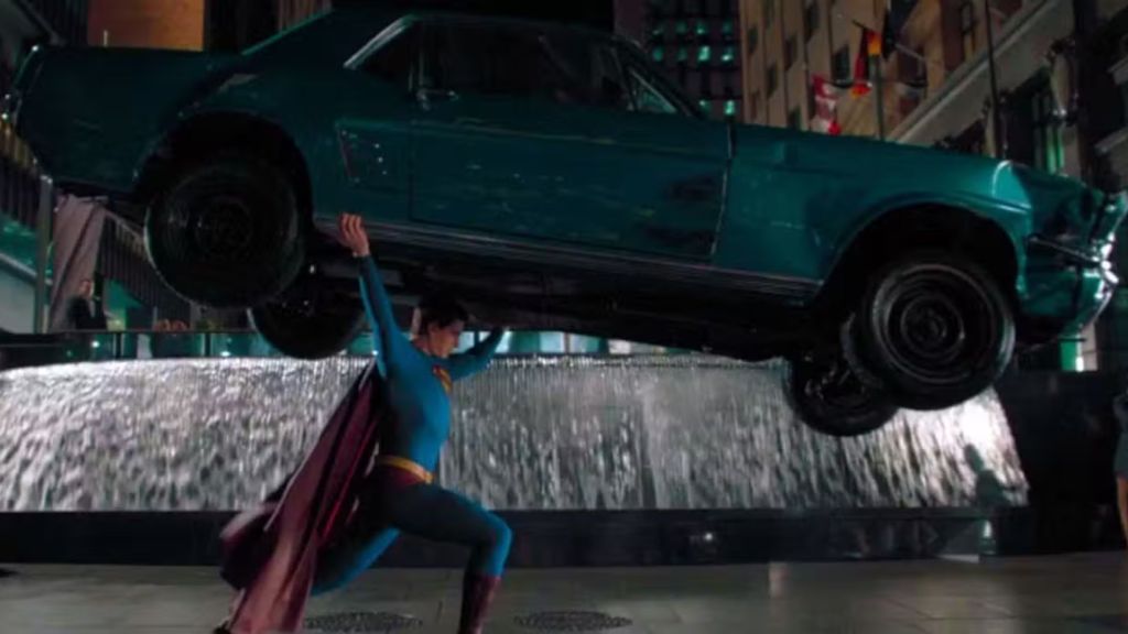 Brandon Routh as Superman lifting a green car