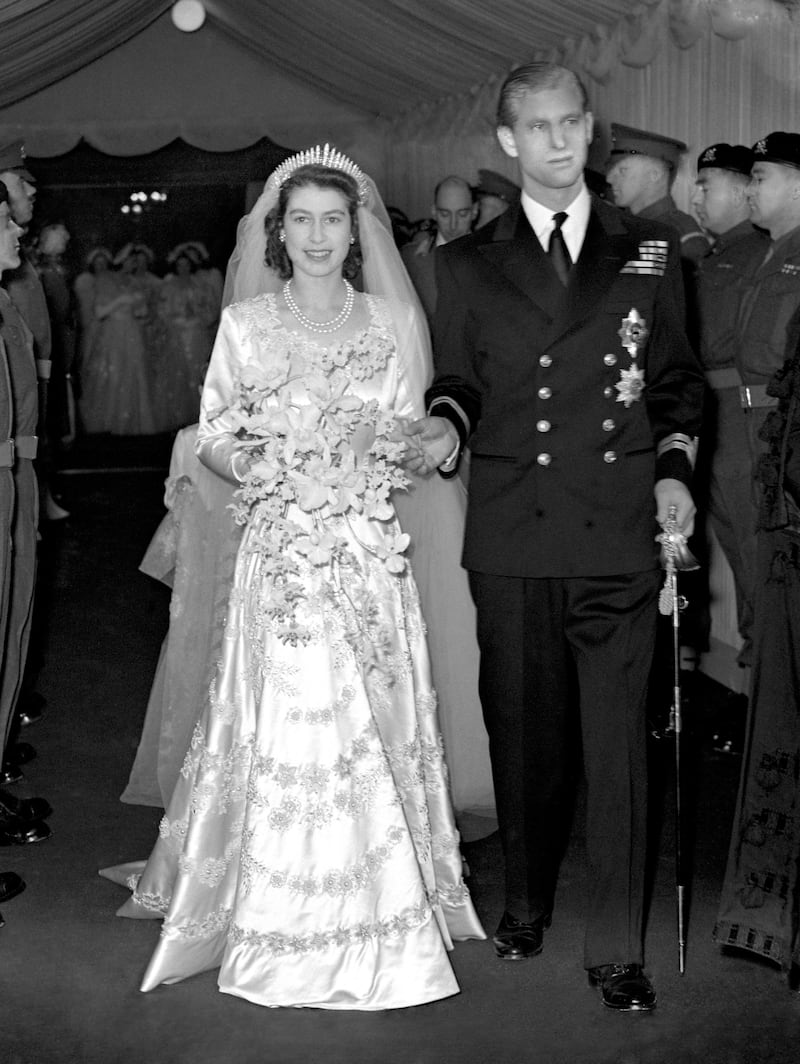 Queen Elizabeth II and her husband Prince Philip, Duke of Edinburgh, leave Westminster Abbey after the wedding ceremony in 1947