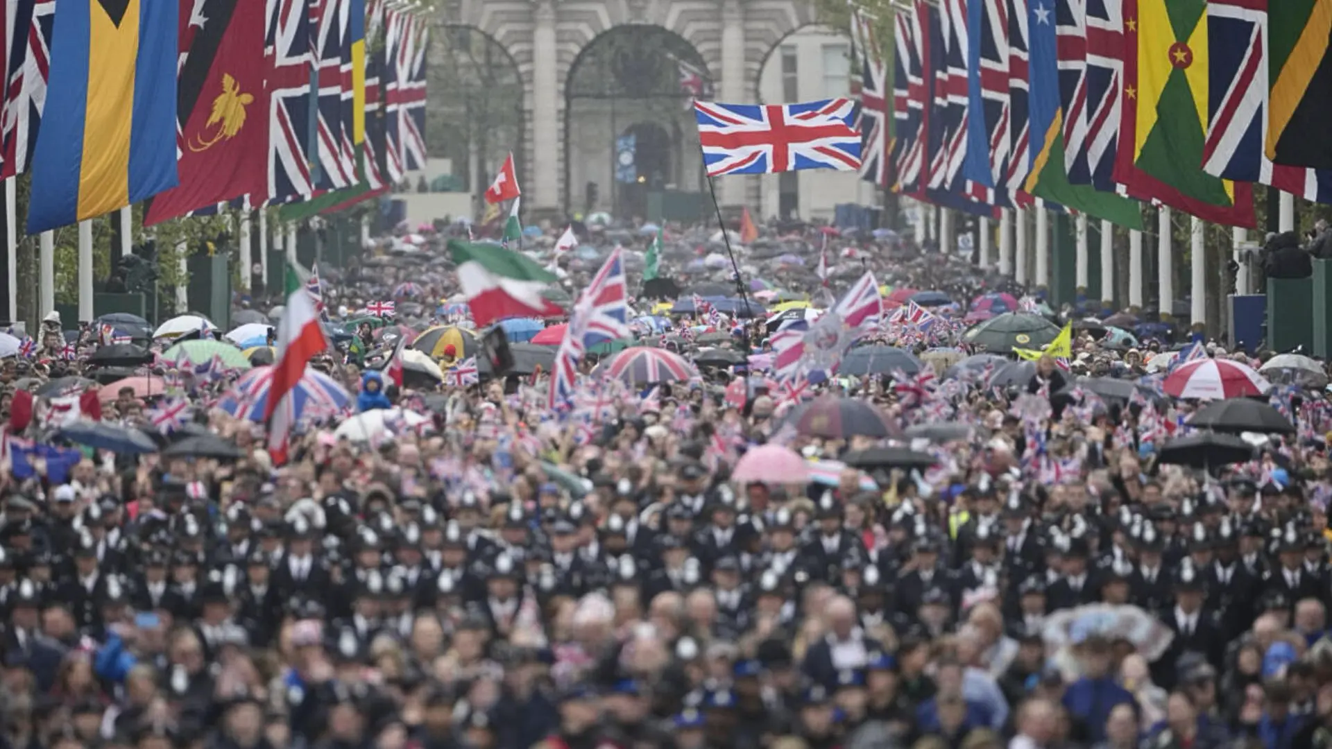 Crowds waving British flags and gathering along London streets during King Charles III’s coronation celebrations