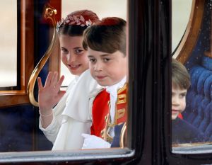 LONDON, UNITED KINGDOM - MAY 06: (EMBARGOED FOR PUBLICATION IN UK NEWSPAPERS UNTIL 24 HOURS AFTER CREATE DATE AND TIME) Princess Charlotte of Wales, Prince George of Wales (in his role as Page of Honour) and Prince Louis of Wales return to Buckingham Palace in The Australian State Coach following King Charles III's and Queen Camilla's Coronation service at Westminster Abbey on May 6, 2023 in London, England. The Coronation of Charles III and his wife, Camilla, as King and Queen of the United Kingdom of Great Britain and Northern Ireland, and the other Commonwealth realms takes place at Westminster Abbey today. Charles acceded to the throne on 8 September 2022, upon the death of his mother, Elizabeth II. (Photo by Max Mumby/Indigo/Getty Images)
