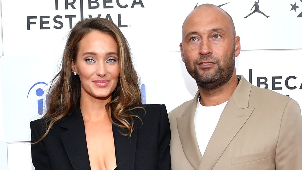 Hannah Jeter and Derek Jeter standing together at The Captain premiere in New York City