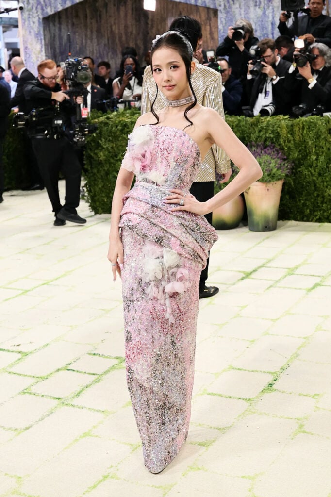 Jisoo wearing Dior embroidered garden column dress with floral headpiece at the Met Gala