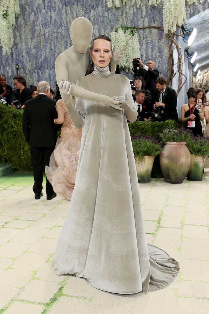 Jordan Roth in custom Robert Wun Couture faceless figure look at the 2026 Met Gala red carpet