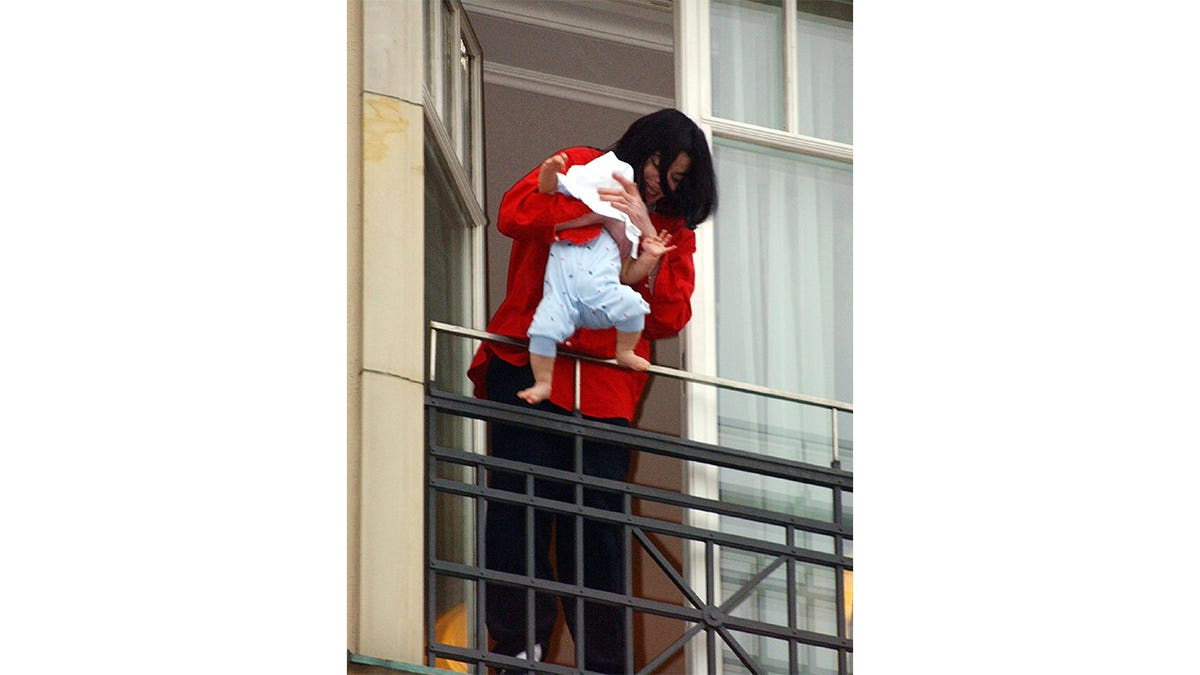 Michael Jackson photographed with his son
