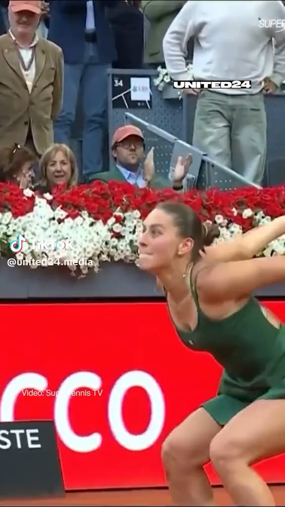 Ukraine's Marta Kostyuk does a victorious backflip to celebrate a historic win over "neutral" Russian athlete Mirra Andreeva 6-3, 7-5 in the final of the Madrid Open.