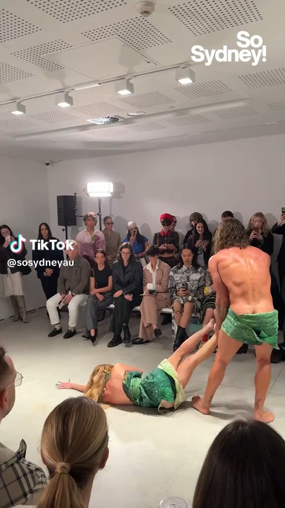 Australian fashion week: a man drags a woman down the catwalk at the lordanes Spyridon Gogos fashion show