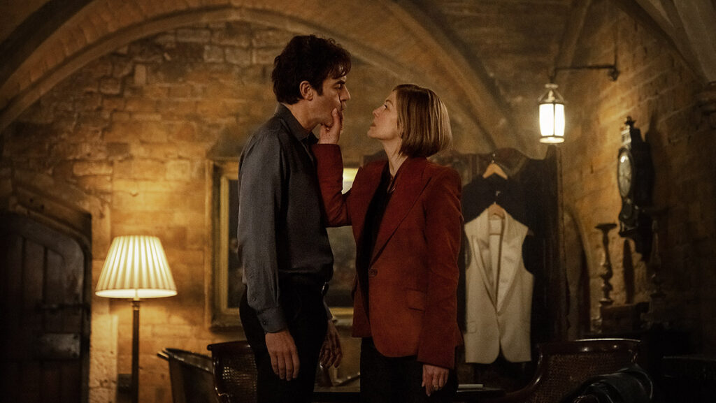 (L-R) Sacha Baron Cohen as Damien Sachs and Rosamund Pike as Alex Fox in Ladies First.