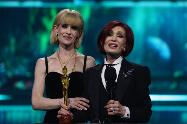 MANCHESTER, ENGLAND - FEBRUARY 28: (EDITORIAL USE ONLY) Kelly Osbourne and Sharon Osbourne accept the 'Lifetime Achievement' award on behalf of the late Ozzy Osbourne on stage during The BRIT Awards 2026 at Co-op Live on February 28, 2026 in Manchester, England. (Photo by JMEnternational/Getty Images)